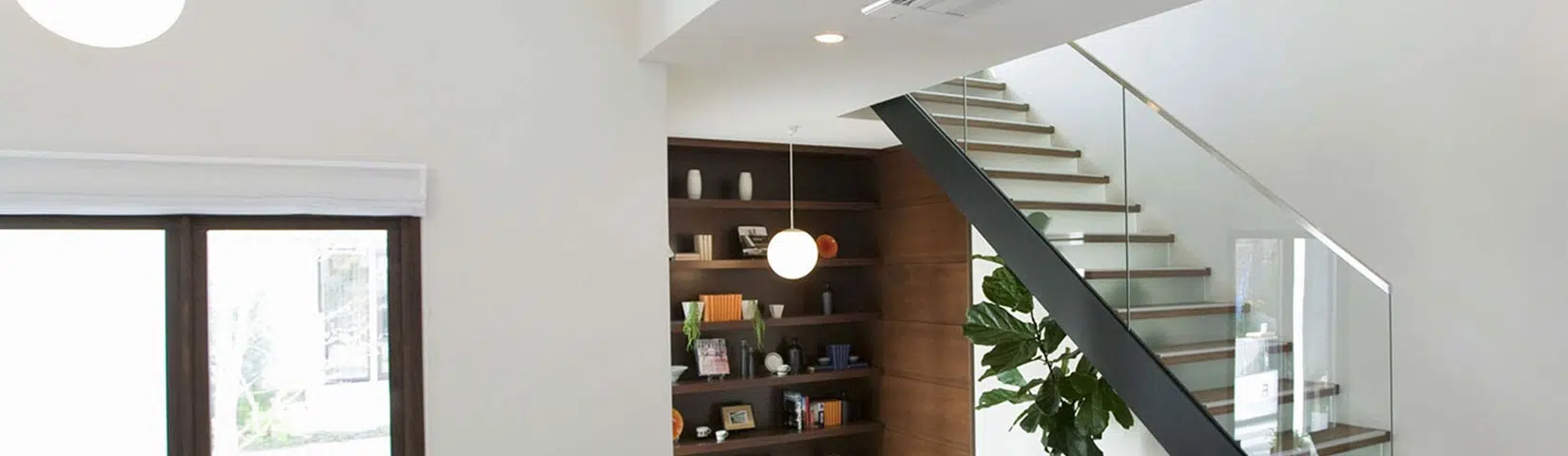 Modern staircase with bookshelf.