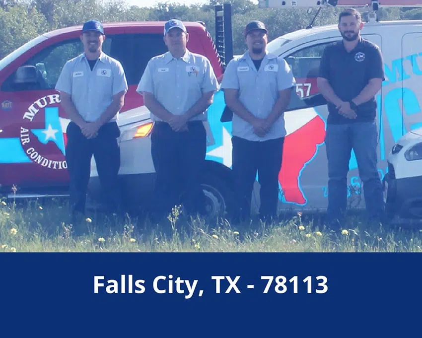 Falls City, TX HVAC technicians in front of company trucks