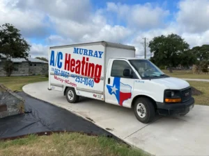 A white GMC box truck with 'Murray A/C Heating' branding in large blue and red letters