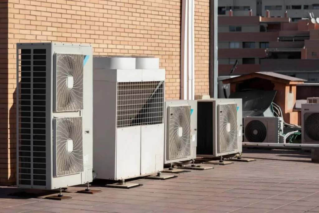Commercial HVAC units on building rooftop.