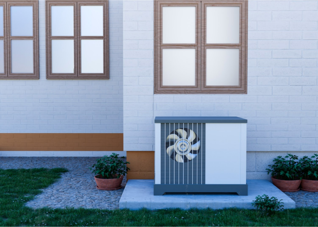 how does air conditioning work? An outdoor air conditioning unit against a white wall with windows.