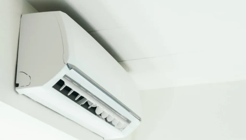 Wall-mounted indoor air conditioning unit operating in a modern room.