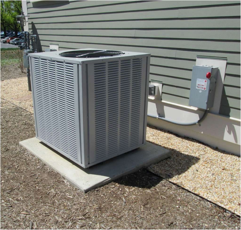 Outdoor air conditioning unit installed near a building.