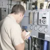 Commercial HVAC Repair - Commercial HVAC technician repairing HVAC system