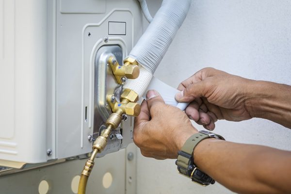 a person fixing office HVAC