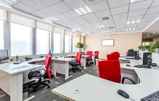 an office with red chairs and alluring interior