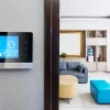 a room with a touch screen device at it entrance